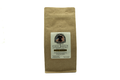 Kraft brown coffee bag with a label on a white background